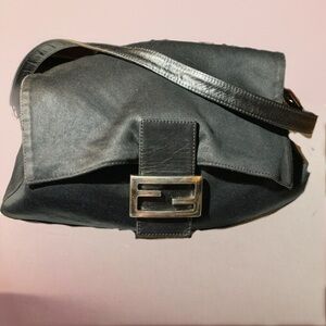 Fendi microfiber black bag with silver tone hardware. Adjustable leather strap.